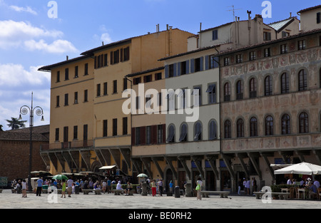 Vast piazza Santa Croce  in Florence with locals and tourists mingle around shops and pavement bars, Florence, Tuscany, Itlay, Stock Photo