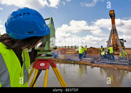 Surveyor working on bridge construction. Stock Photo