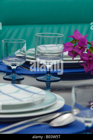 blue and white plates and wine glasses on the dinner table Stock Photo