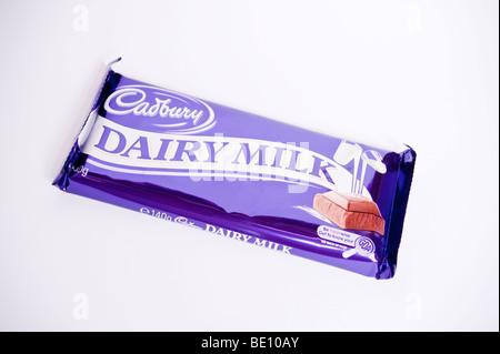 A close up of a bar of cadbury dairy milk chocolate on a white background Stock Photo