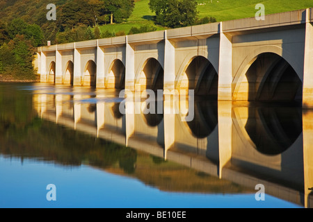 The Ashopton Viaduct, reflected in the still water of Ladybower Reservoir, one of the Derwent Dams at Ashopton, Derbyshire Stock Photo