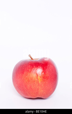 A close up of a fresh red apple on a white background Stock Photo