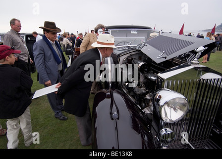 Concours judge inspecting a 1933 Rolls-Royce Phantom II Continental coupe at the 2009 Pebble Beach Concours d'Elegance Stock Photo