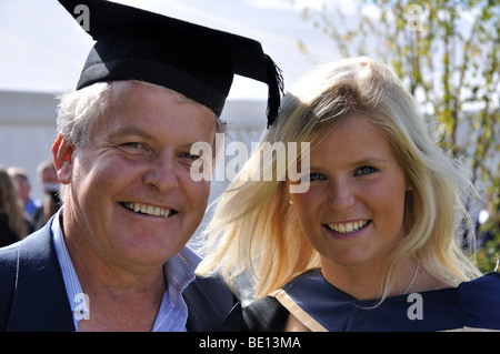 Young female University graduate with her father, Oxford Brookes University, Headington, Oxfordshire, England, United Kingdom Stock Photo