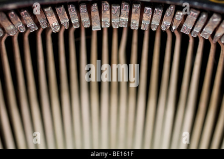 Semi-abstract view of the key strike bars on an old-fashioned typewriter. Stock Photo