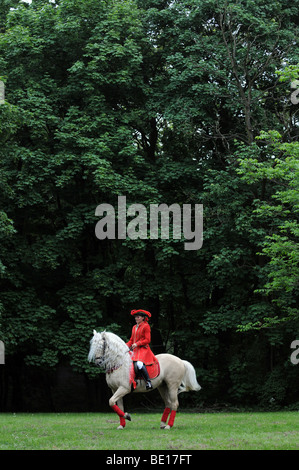 Woman in costume from XVII century on her horse during baroque horse ...