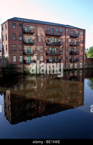 Former warehouse on the River Aire converted to apartments, Leeds city centre, Yorkshire UK Stock Photo