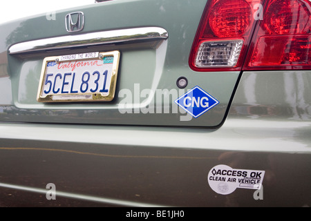 A rear view of Honda Civic natural gas vehicle (NGV) with a CNG (compressed natural gas) and Clean Air Vehicle stickers. USA Stock Photo