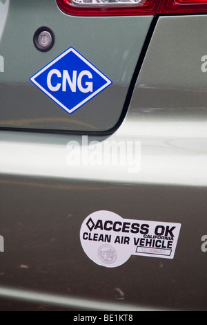 A close up of CNG (compressed natural gas) and Clean Air Vehicle stickers on a Honda Civic natural gas vehicle (NGV). California Stock Photo