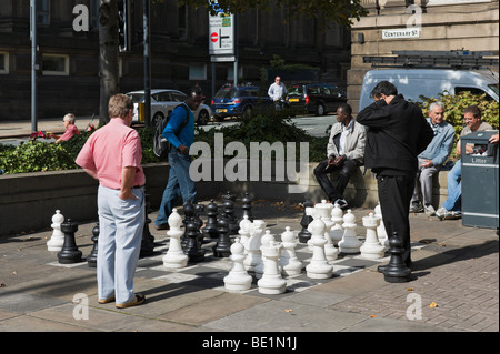 Giant open air chess in front of the City Library and Art Gallery on the Headrow, Leeds, West Yorkshire, England Stock Photo