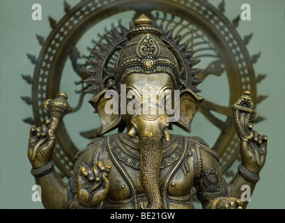 bronze Hindu god Ganesh in front of a bronze statue of Shiva Nataraja Stock Photo