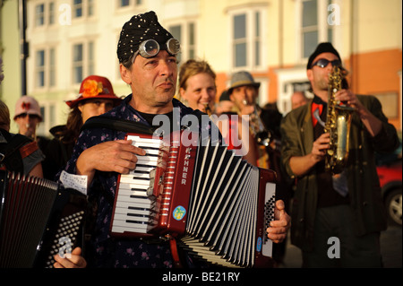 Musicians in the De Propere Fanfare belgian marching band performing on the promenade, Aberystwyth Wales UK Stock Photo