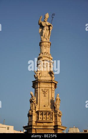 Colonna di San Oronzo at dusk, Piazza della Liberta, Old Town, Ostuni, Brindisi Province, Puglia Region, Italy Stock Photo