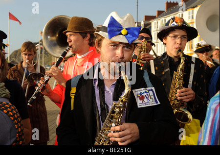 Musicians in the De Propere Fanfare belgian marching band performing on the promenade, Aberystwyth Wales UK Stock Photo