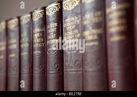 A row of books by Charles Dickens including Oliver Twist and Great Expectations. Stock Photo