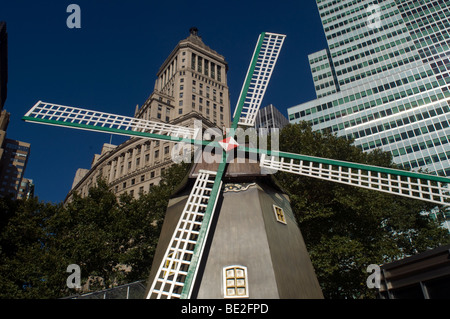 A windmill forms the centerpiece of the New Amsterdam Village in Bowling Green Park in New York Stock Photo