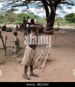 Hadzabe man practicing archery Stock Photo
