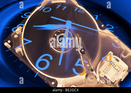 Clock and Computer Hard Disk Stock Photo