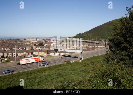 M4 motorway at junction 40 for Port Talbot with mixed traffic including Turners lorry Stock Photo