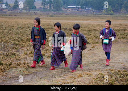 Young school children  wearing traditional dress uniform in school near Gantey Bhutan Asia. 91904 Bhutan-Wangdue Stock Photo