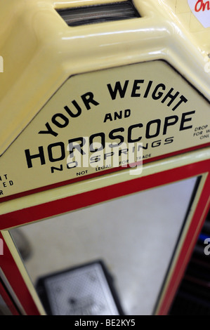 A scale that gives weight and horoscope Stock Photo