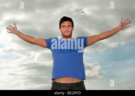 man stretching arms out Stock Photo - Alamy