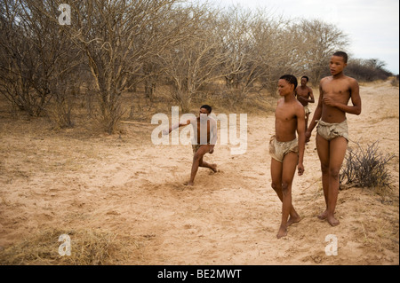 Naro bushman (San) playing the stick throwing game, Central Kalahari, Botswana Stock Photo