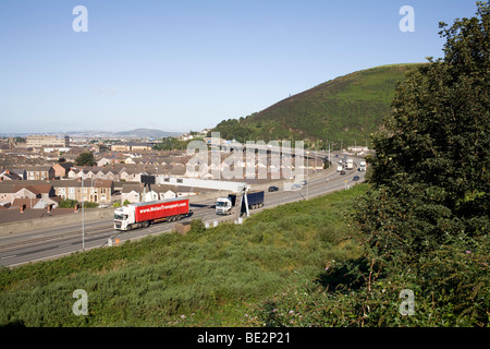 M4 motorway road at Port Talbot, junction 40 with Nolan Transport lorry Stock Photo