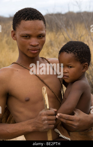 Naro bushman (San) father and son, Central Kalahari, Botswana Stock Photo