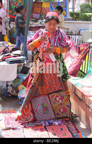 Kuna indian woman with some molas at a street market in Panama City. For Editorial Use Only. Stock Photo