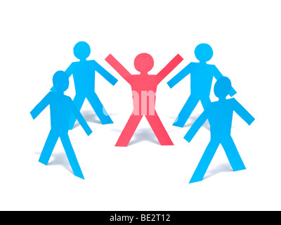 A red paper man is raising his arms among the blue paper men group. Stock Photo