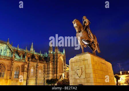 Equestrian statue of King Nuno Alvares Pereira in front of the Dominican monastery Mosteiro de Santa Maria da Vitoria at night,