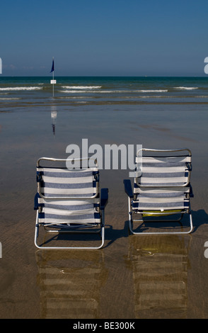 Two folding chairs on the beach Stock Photo