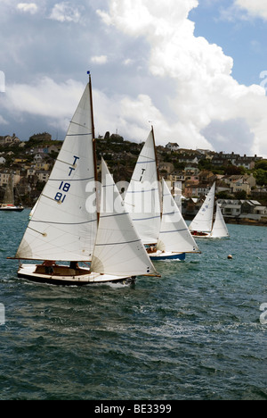 looking out across fowey river with several Troy class dinghies racing in front of Polruan Stock Photo