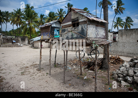 Two buildings, houses on stilts, floating, on the Tonle ...