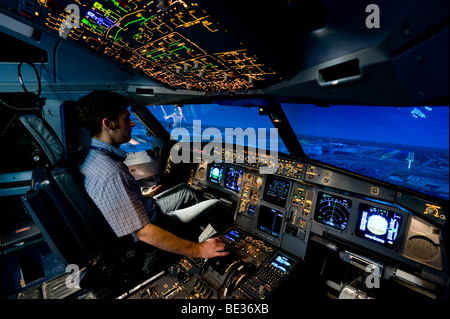 Zentrum fuer Flugsimulation Flight Simulation Center Berlin, ZFB, engineer in the cockpit of an Airbus A330/340 flight simulato Stock Photo