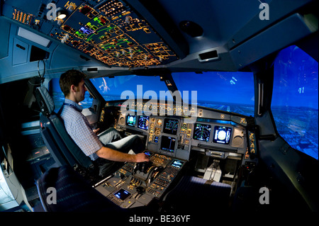 Zentrum fuer Flugsimulation Flight Simulation Center Berlin, ZFB, engineer in the cockpit of an Airbus A330/340 flight simulato Stock Photo
