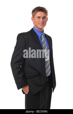 Confident young businessman standing and smiling Stock Photo
