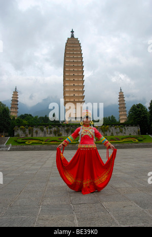 Chinese woman of the Bai ethnic group in a red dress, Three Pagodas, Dali, Yunnan Province, People's Republic of China, Asia Stock Photo
