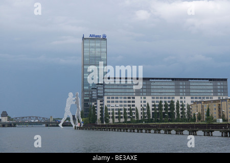 Treptowers high-rise building, Allianz insurance building and sculpture Molecule Men on the Spree, Treptow district, Berlin, Ge Stock Photo