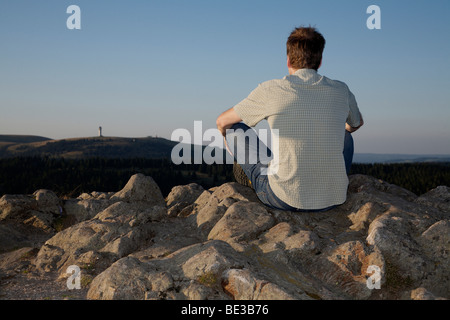 Man, mid 40s, looking from Herzogenhorn Mountain towards Feldberg Mountain in the Black Forest, Baden-Wuerttemberg, Germany, Eu Stock Photo