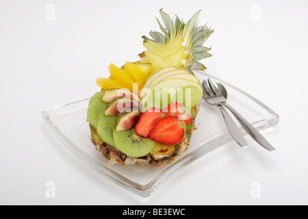 Colourful fruit salad in a baby pineapple Stock Photo