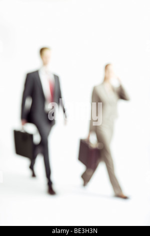 Business people walking, out of focus Stock Photo