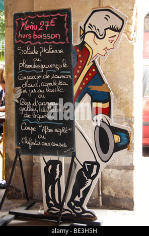 Menu written on a blackboard, in front of an old restaurant in the centre of Paris, France, Europe Stock Photo