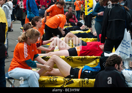 After the race runners can get massages, half marathon with over 25, 000 runners and wheelchair users, Berlin, Germany, Europe Stock Photo