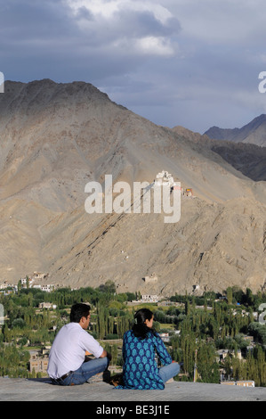 Ladakhi people looking on the Leh oasis with Gonkhang monastery and castle ruins on the mountain, Ladakh, India, Himalayas, Asia Stock Photo