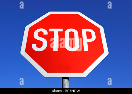 Stop sign against blue sky Stock Photo