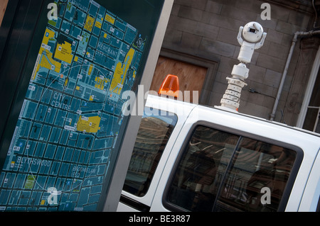 A mobile CCTV van parked next to a map of Glasgow City Center outside Glasgow Central Station. Stock Photo