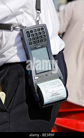 Porter with Casio Handheld Printer Terminal, finished ticket in the printer, harbor cruise, Duisburg-Ruhrort, North Rhine-Westp Stock Photo