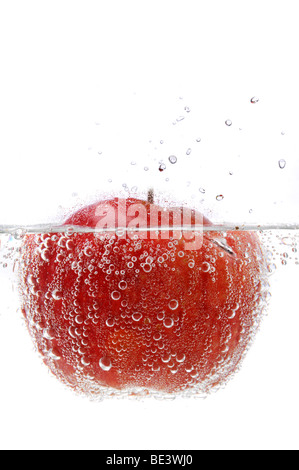 Apple in splashing water isolated on a white background Stock Photo